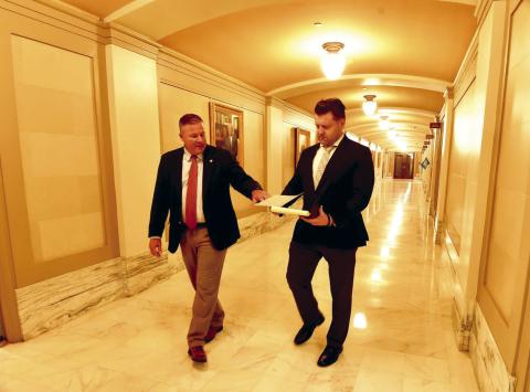 During session, Senate President Pro Tempore Lonnie Paxton (R-Tuttle) and spokesperson Alex Gerszewski go over information between meetings at the state Capitol. M. Scott Carter | Southwest Ledger