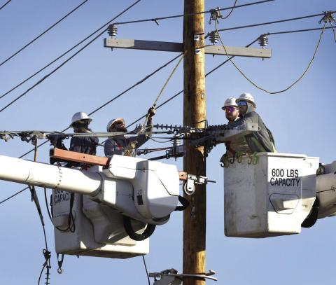 PSO linemen in aerial buckets work on several electric lines. Provided
