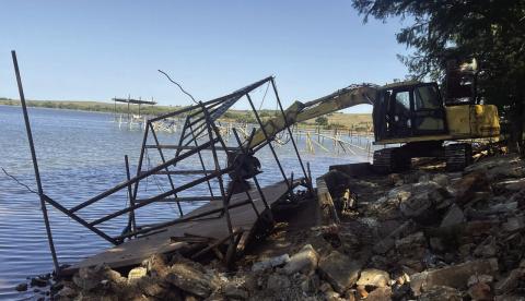 This excavator was used in the demolition of 13 docks on the southeast side of Lake Chickasha