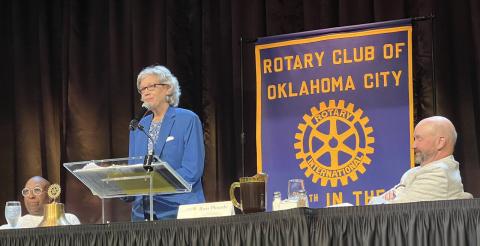M. Scott Carter | Southwest Ledger Former Hochatown Mayor Dian Jordan tells Hochatown’s story to members of an Oklahoma City Rotary Club last week. Jordan is on stage with Byron Jackson, left, and Ross Plourde, club president.