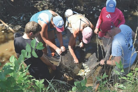 Photo courtesy Oklahoma Conservation Commission, Oklahoma Conservation Commission “Blue Thumb” staff and volunteers conduct a fish collection and physical habitat survey in El Reno. Participants in the survey included, from left: David Moyer, Blue Thumb intern; Beck Zawalski, Blue Thumb field educator; Kim Shaw, Blue Thumb quality assurance officer; Rebecca Bond, Blue Thumb director; and Jonathan Kubilis of Redlands Community College.