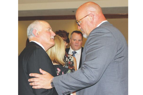 Southwest Ledger photo by Curtis Awbrey, Lawton Mayor Stan Booker and President / CEO of the Lawton-Fort Sill Economic Development Corporation Brad Cooksey visit after the Lawton-Fort Sill Chamber of Com- merce’s State of the City luncheon at the Lawton Country Club on Thursday, Sept. 12. Lawton City Manager Michael Cleghorn is shown in the background.