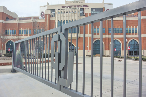 Ledger photo by Michael Duncan A gate is closed in front of the Gaylord Family-Oklahoma Memorial Stadium on the University of Okla- homa campus in Norman. OU’s flagship campus is closed due to a confirmed case of the COVID-19 coronavirus.