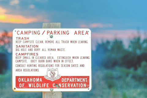 Photo provided Signage by the Oklahoma Department of Wildlife Conservation outline the rules for camping and parking areas including trash, sanitation and campfires.