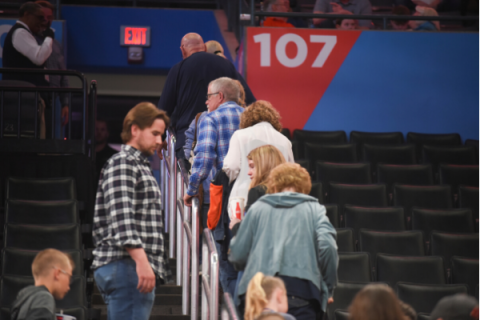 Basketball fans leave Chesapeake Energy Arena after it is announced that an NBA basketball game between Oklahoma City Thunder and Utah Jazz in Oklahoma City has been postponed March 11. AP file Photo/Kyle Phillips