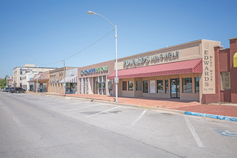 Photo by Chris Martin         Parking spaces are empty in front of storefronts in downtown Lawton.