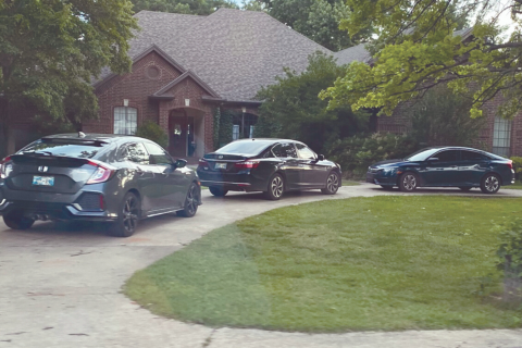 Vehicles are parked in the driveway at 1212 Mockingbird Lane in Guthrie.