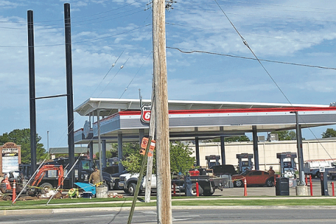 Crews work on new signage for the EZ Go station located at 5120 S.W. Lee Blvd in Lawton. Ledger photos by Curtis Awbrey