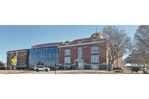A vehicle is parked in front of Lawton City Hall.