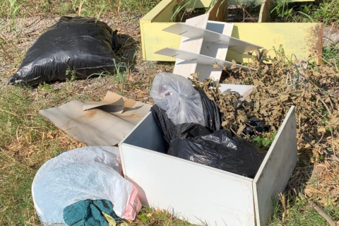 Ledger file photo by Mike W. Ray Trash bags, a wooden box and broken shelves were laying in the bar ditches on either side of Railroad Street within a mile of Pecan Road on Monday.