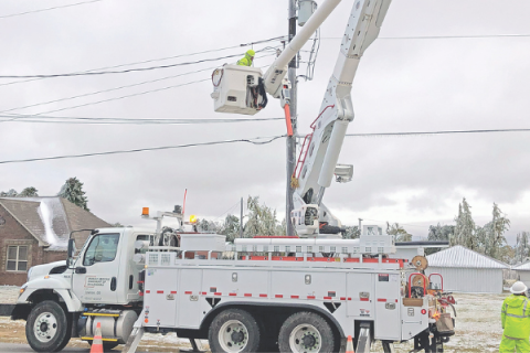 Photo provided             A Public Service Co. of Oklahoma line crew repairs damage at Fletcher from the October ice storm.