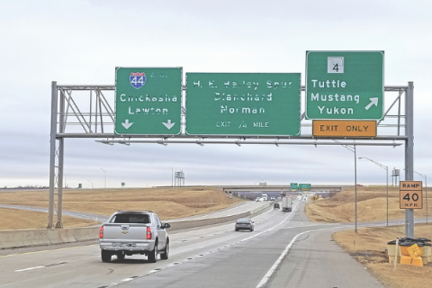 Ledger photos by Andrew W. Griffin Motorists pass by highway signs in disrepair on the H.E. Bailey Turnpike.
