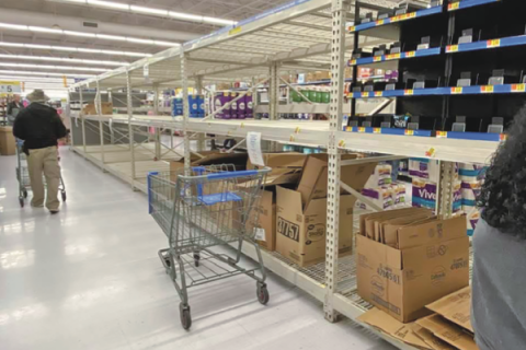 Ledger photo by Curtis Awbrey Just a few packages remain on the shelves five minutes after associates stocked two pallets of toilet paper at the Altus Walmart Supercenter on March 13, 2020. Due to high customer demands during the coronavirus pandemic, Walmart enforced a two-package limit on toilet paper and cases of bottled water. Associates scrambled to stock toilet paper and other items as customers picked the shelves clean. Four pallets of toilet paper were purchased within 20 min., one associate said.