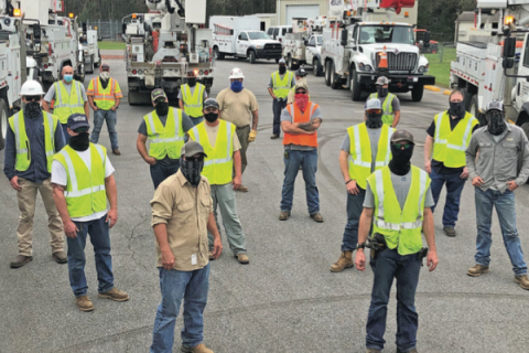 PSO line crew workers gather in a staging area as they prepare to provide mutual assistance in the wake of Hurricane Sally, which struck the U.S. Gulf coast last September. Public Service Co. of Oklahoma photo.