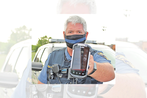 City of Lawton, file Sgt. Chris Tally of the Lawton Police Department displays a Zebra eCitation electronic ticket-writer.