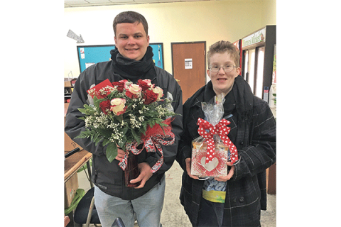 Photo courtesy Sheila DeCarlo Think Ability crew members Taylor Vaughn and Ellie Williams stop for a quick pose heading out on another delivery Friday before Valentine's Day