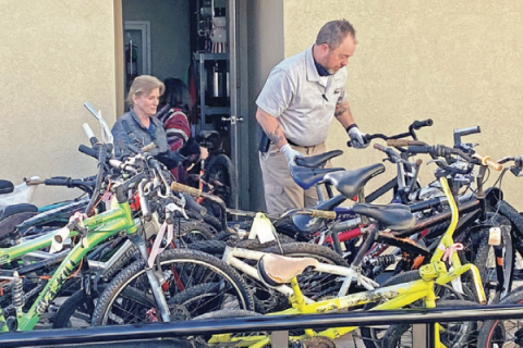 hoto courtesy Kim Davis, The Toy Shop Katherine Smith watches as Layle Baker unloads some of the 85 bicycles re- covered by the Duncan Police Department and were declared surplus by the City Council. The bikes were donated to the Toy Shop in Duncan, to provide Christmas gifts for needy children.