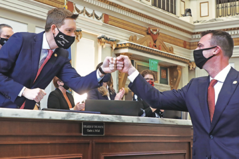 Legislative Service Bureau Photography        Lt. Gov. Matt Pinnell, left, fist-bumps Gov. Kevin Stitt before the State of the State address Monday at the Oklahoma Capitol in Oklahoma City.