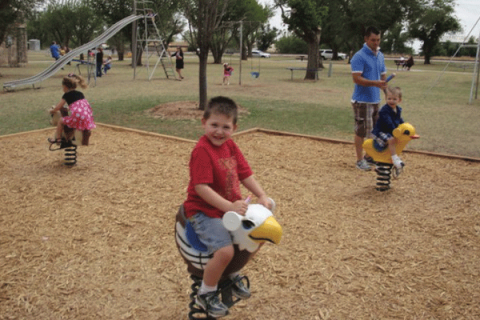 All photos by Kim Keller/Town of Olustee: Children use playground equipment in Olustee’s town park. Over the past 16 years, the town has made several upgrades to its park.