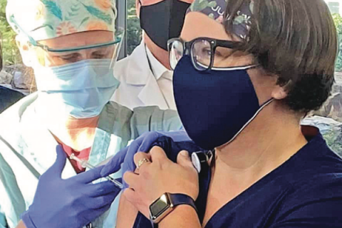 Comanche County Memorial Hospital photo via Facebook, file - A registered nurse receives a dose of COVID-19 vaccine in December 2020 at CCMH in Lawton   