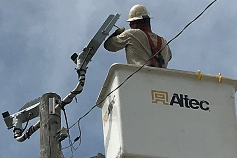 A PSO contractor installs a new streetlight. Photo provided