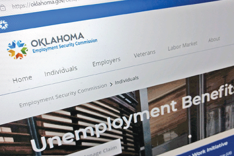 LEDGER PHOTO BY BRYAN M. RICHTER A page from the Oklahoma Employment Security Commission website is displayed on a laptop computer. 
