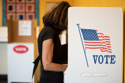 A woman votes at a polling station in Norman on Aug. 25, 2020. Whitney Bryen | Oklahoma Watch