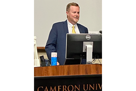 Chad Wilkerson, branch executive of the Kansas City Federal Reserve’s Oklahoma City office, addresses the audience during a Nov. 18 forum at Cameron University. Wilkerson joined Lawton businessmen Phil Kennedy and Hossein Moini for a forum about the global supply chain disruption.