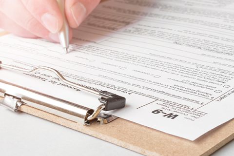 Someone filling out legal forms