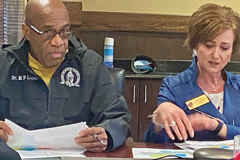 Lawton Redistricting Commission member Michael Logan, left, listens as Planning Director Janet Smith addresses the commission 