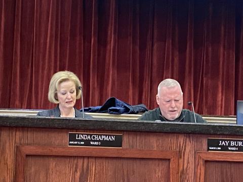 From the left, Lawton City Council members Linda Chapman and Jay Burk prepare for Tuesday’s meeting at Lawton City Hall. The council voted to establish the Lawton Youth Sports Authority, which will oversee the city’s youth sports programs. Eric Swanson/Ledger photo