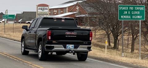 One of the signs honoring the late Jim Glover of Elgin, former House Speaker Pro Tempore, in the eastbound right-of-way of SH-17 in Comanche County.  CURTIS AWBREY/LEDGER PHOTO