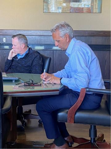 Caption: From the left, Lawton City Manager Michael Cleghorn listens to a discussion while Lawton Youth Sports Authority member Hossein Moini takes notes during Thursday’s Youth Sports Authority meeting at City Hall. The authority approved an agreement with the city that will help the authority bridge the gap between now and the end of fiscal year 2021-22. Eric Swanson/Staff photo