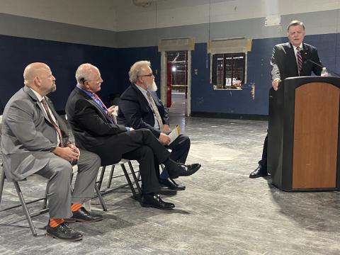 From the left, Civilian Assistant to the Secretary of the Army Michael Brown, Lawton Mayor Stan Booker and FISTA Development Authority Chairman Clarence Fortney listen to U.S. Rep. Tom Cole during FISTA’s construction kickoff event April 15 at Central Plaza. FISTA is remodeling the old Sears store on the west side of Central Plaza into a hub for defense contractors.  Eric Swanson/Staff photo