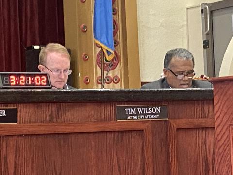Caption: From the left, Acting City Attorney Tim Wilson and Lawton City Councilman Allan Hampton listen to a discussion during the council’s April 12 meeting. The council sent a proposed ordinance, which would have authorized the city manager or his designee to set operating hours for recreational facilities, back to the city attorney for revision. 