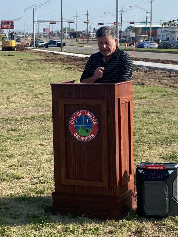 Mike Jones, ADA coordinator for the city of Lawton, speaks during a groundbreaking ceremony for a sidewalk construction project Thursday near the intersection of Northwest Sheridan Road and Northwest Lincoln Avenue. The city is building a sidewalk on the west side of Sheridan that will stretch from Northwest Smith Avenue to Northwest Cache Road.  Eric Swanson/Staff photo