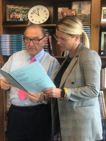 Attorney Bob Burke, left, and Liz George review court documents that ask the Oklahoma Supreme Court to intercede in the fight to incorporate Hochatown.  Photo provided by Dian Jordan