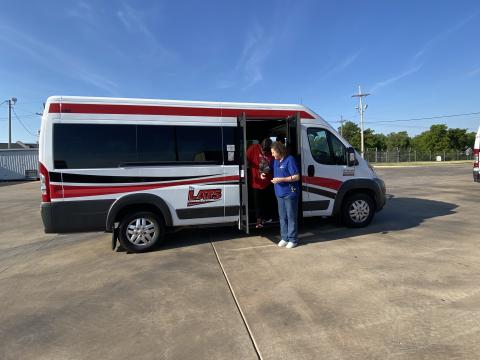 LATS/LCB2: Rae FitzPatrick, president of the Lawton Council of the Blind, assists Lawton Area Transit System driver Thomas Cratch as he disembarks one of LATS’ paratransit vehicles on Saturday, July 16. Cratch, who’s driven for LATS for more than a decade, is wearing distortion goggles which demonstrate challenges people who are visually impaired face every day. Ledger photos by Curtis Awbrey