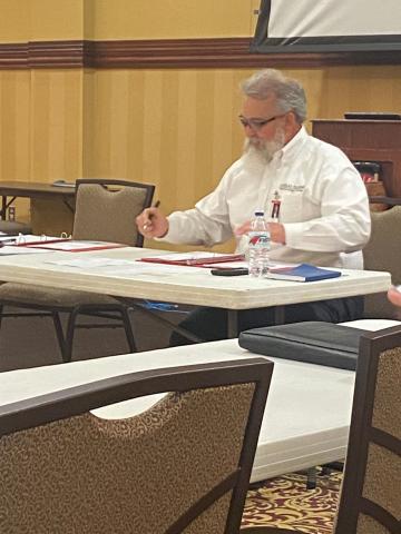FISTA Development Trust Authority Chairman Clarence Fortney reviews documents before Tuesday’s meeting at Lawton City Hall. The board approved several change orders for the remodel of the former Sears building in Central Plaza.  Eric Swanson/Staff photo