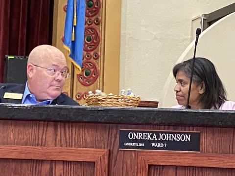 From the left, Lawton City Councilman Sean Fortenbaugh and Councilwoman Onreka Johnson chat before the council’s Aug. 23 meeting. The council approved a proposal to extend the deadline for city workers to show proof of vaccination against COVID-19 but rejected a plan to raise t back-to-work incentives from $1,000 to $7,500. Eric Swanson/Staff photo