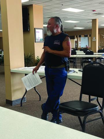 Comanche County Veterans Council Chairman George Keck explains how to sign up for the Oklahoma Veterans Registry during an Aug. 20 meeting at Bingo Country in Lawton. Disabled veterans who are exempt from sales taxes must register with the state by July 1, 2023, to keep the exemption. Eric Swanson/Staff photo