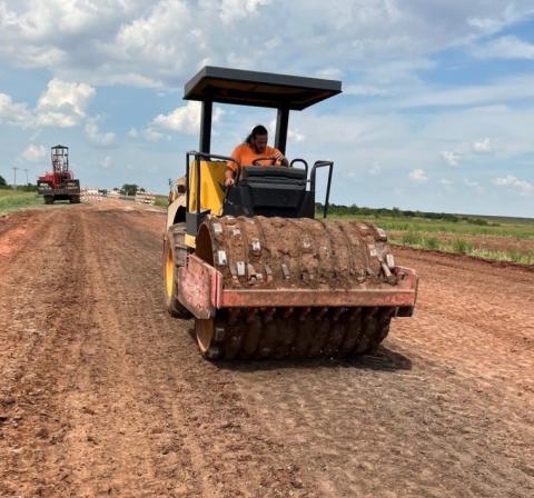 A soil compactor compresses what soon will be a widened section of State Highway 36 on the south side of a new bridge spanning Deep Red Creek north of Grandfield. Three bridges in that vicinity which were built in the 1930s have been replaced. The highway approaching each end of the three crossings is being widened to add shoulders and guard rails, and new asphalt paving will be installed.  Ledger photo by David B. Hale