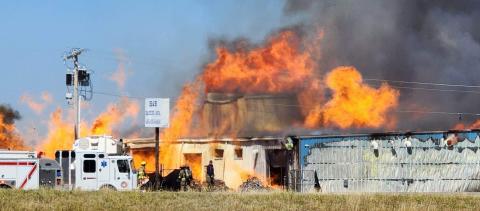 A raging fire erupted around 1 p.m. Oct. 18 at a warehouse located in Ninnekah, just south of U.S. Highway 81 and State Highway 19; an estimated 1,500 to 2,000 pallets of ethanol-laced hand sanitizer were stored at the site formerly occupied by H&B Machine & Manufacturing. Boiling smoke was visible from Interstate 44. (Ledger photo by Steve Booker)