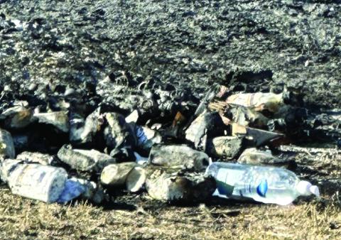 Ashes were just about all that remained after a fire Oct. 18 destroyed dozens of pallets of recalled Blumen hand sanitizer stored at Ninnekah.  LEDGER PHOTO/JJ FRANCAIS