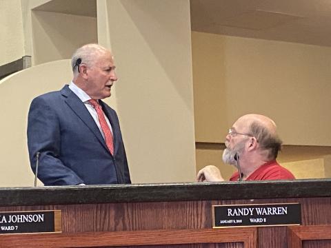 From the left, Lawton Mayor Stan Booker talks to Councilman Randy Warren before the council’s Nov. 15 meeting. The council voiced concerns about what will happen at School House Slough after the current concessionaire’s lease expires Dec. 31. ERIC SWANSON/STAFF PHOTO