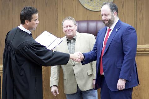 From the left, District Judge Grant Sheperd administers the oath of office to commissioners John O’Brien and Josh Powers Dec. 30, 2022, in the jury room on the second floor of the courthouse. O’Brien and Powers pledged to support the U.S. Constitution, the Oklahoma Constitution and federal and state laws. CARL LEWIS | SOUTHWEST LEDGER