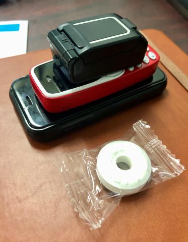 These are some examples of contraband cell phones confiscated in state prisons by the Oklahoma Department of Corrections. For reference, that’s a Lifesaver mint next to the phones. OKLAHOMA DEPARTMENT OF CORRECTIONS