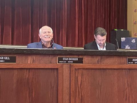 From the left, Lawton Mayor Stan Booker and City Attorney John Ratliff prepare for a Lawton City Council meeting Friday at City Hall. The council repealed an ordinance, which was set to take effect this month, requiring all businesses to obtain a general business license. ERIC SWANSON | SOUTHWEST LEDGER