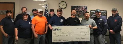 Volunteers with the Grady County Fire Department display the enlarged check for $20,000 that was donated last week by Gulfport Energy. GRADY COUNTY VOLUNTEER FIRE DEPARTMENT