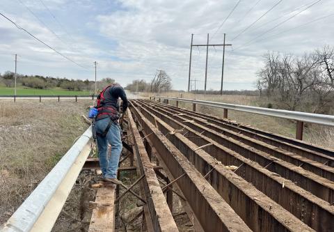 Road crews from Comanche County replace bridge decking on the King Road bridge near River Drive north of Fletcher. JJ FRANCAIS | SOUTHWEST LEDGER